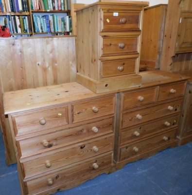 A pine bedside cabinet of three drawers, and two chests of drawers, with two short over three long drawers raised on shaped aprons and bracket support.(3)