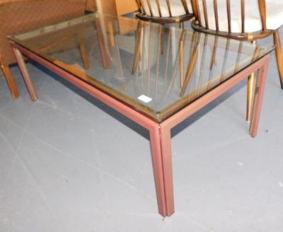 A brass and glass rectangular coffee table.