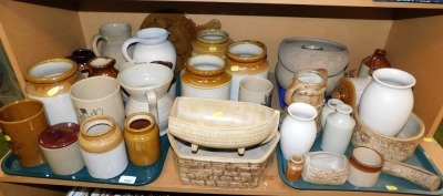 Stoneware items to include storage jars, jugs, bowls, hot water bottles, etc. (1 shelf)