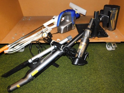 A cordless Shark vacuum cleaner model no. WV361UK with charging station, a Beldray cleaner, a Quest hand held vac, etc.