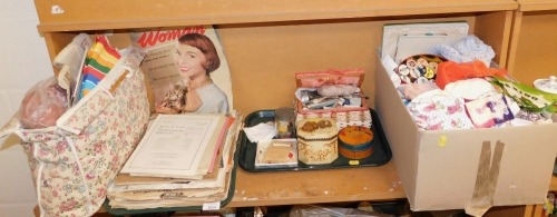 A collection of Woman magazines, various other printed works including sheet music, needle work items to include cottons, textiles, etc. (1 shelf)