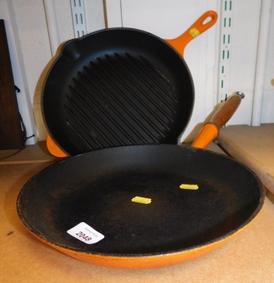 A Le Creuset griddle pan and a skillet.