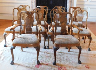 A George II style walnut extending dining table, the oval burr top with a carved edge, raised on four shell and scroll carved legs with raised beading, on hairy paw feet, 75cm high, the top 121cm x 150cm, with winder, together with a set of ten Queen Anne - 4