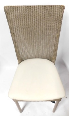 A set of fourteen Lloyd Loom of Spalding wicker dining chairs, each with a tapering high back, overstuffed seat, on turned legs, painted in taupe, bearing brass plaque. - 2