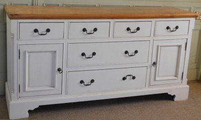 A modern pine and cream painted sideboard, the top with a moulded edge above four short drawers above two longer drawers flanked by panelled cupboards, on bracket feet, 92cm high, 176cm wide, 46cm deep. - 2