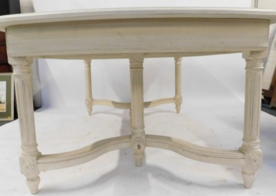 A 20thC Continental cream painted extending dining table, the rectangular rounded top with a moulded edge above cylindrical fluted legs with carved decoration, united by shaped stretchers, 78cm high, the top 210cm x 123cm, with two additional leaves, each - 3