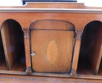 A 20thC yew desk, the raised top with an arrangement of recesses, central cupboard and drawers, etc., with a gilt tooled leather inset above a central frieze drawer flanked by two four drawer pedestals, on bracket feet, 105cm high, 152cm wide, 92cm deep. - 3