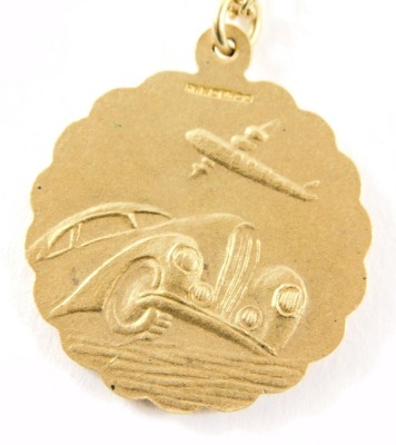 A 9ct gold pendant and chain, the St Christopher circular pendant reverse inscribed with a car and aeroplane, 2.5cm diameter, on curb link neck chain, 60cm long, 11g. - 2