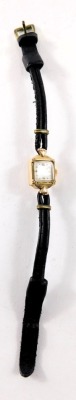 A 9ct gold cased lady's cocktail watch, with a square dial with silvered backing and black hands, 1cm diameter, on a two strand black leather strap, 9g all in. - 2