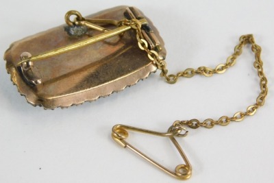 A Victorian memorial brooch, with rectangular window panel, inset plated lockets of hair, with seed pearl surround, and safety chain, yellow metal, unmarked, 2.2cm W, 5g all in. - 2