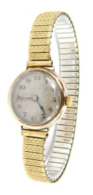 A Rolex 9ct gold lady's wristwatch, with a circular silvered numeric dial, in a 9ct gold case, with Rolex Prima fifteen jewel movement, 2cm diameter, on an expanding stainless steel and plated strap, 25.4g all in.