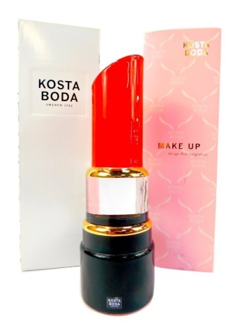 A Kosta Boda makeup glass sculpture by Asa Jungnelius, modelled as a lipstick, 21cm high, boxed with outer sleeve.