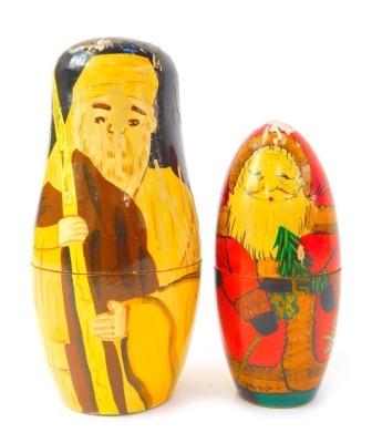 Two Russian Matryoshka nesting dolls, comprising doll depicting Father Christmas, the largest 14cm high, the other decorated with biblical figures, 18cm high.