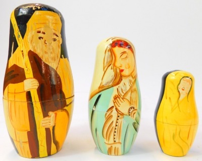 Two Russian Matryoshka nesting dolls, comprising doll depicting Father Christmas, the largest 14cm high, the other decorated with biblical figures, 18cm high. - 2