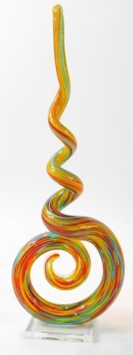 A 20thC Murano twisted glass sculpture, decorated with flashes of blue, red and yellow, on a rectangular glass base, 42cm high. - 2