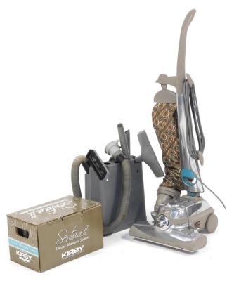 A Kirby Sentria upright vacuum cleaner, together with various attachments and Kirby Home Care system, boxed.