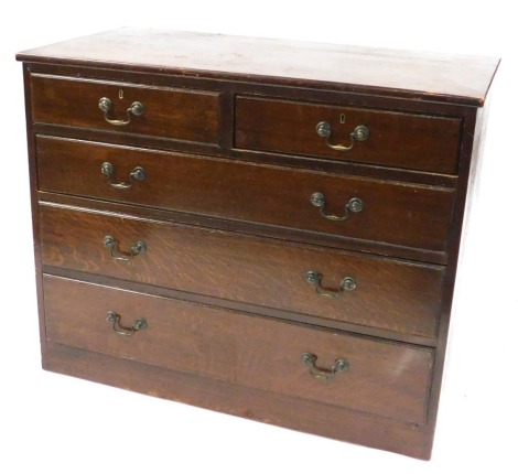 A mid century Air Ministry oak chest, of two short over three long drawers, on a plinth base, stamped to back A.M, 87cm high, 106cm wide, 55cm deep.