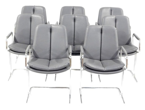 A set of eight late 20thC metal framed Eleganza type armchairs, in the manner of Tim Bates for Pieff, with grey leather seats and backs. The upholstery in this lot does not comply with the 1988 (Fire & Fire Furnishing) Regulations, unless sold to a known 