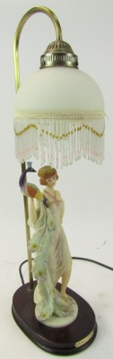 A Juliana Collection table lamp, with frosted glass shade decorated with fringed bead work, above a figure of a lady holding a peacock, on a circular hardwood base, 60cm high. - 2