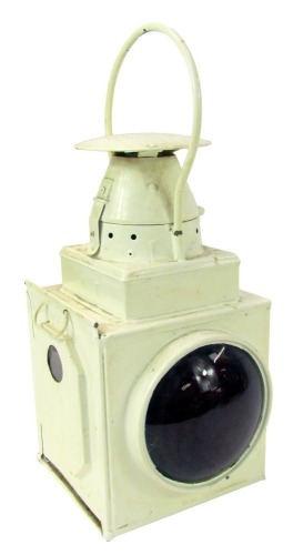 A cream painted railway lantern, 40cm high.