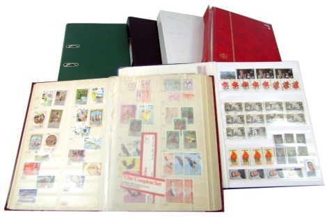 Six albums containing world stamps, to include West Indies, Mongolia, Africa, etc.