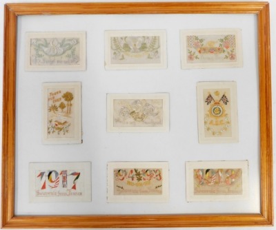 Nine early 20thC silk postcards, to include 1918 souvenir from France, 1917 Souvenir from France, How I Miss You, To My Boy, etc., contained in a framed display measuring 50cm x 59cm. - 2