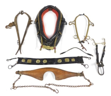 A wooden leather and brass horse collar, together with hames, further horse related bridlery, a wooden yoke with hangers, etc.