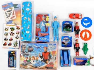 A group of Thunderbirds related ephemera, to include an Alan Tracy talking action figure, wrapping paper, Captain Scarlet Mysterious Puzzle, soap, further figures, etc. - 3