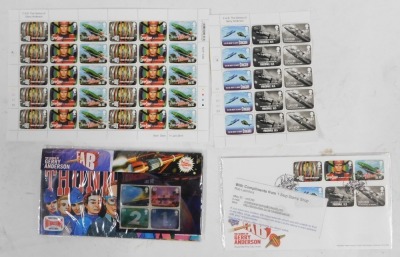 A group of Thunderbirds related ephemera, to include an Alan Tracy talking action figure, wrapping paper, Captain Scarlet Mysterious Puzzle, soap, further figures, etc. - 4