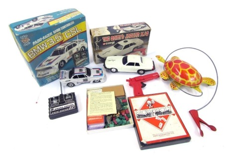 A Radio Racer radio controlled BMW 3.5 CSL car, together with a Corgi The Saint's Jaguar XJS, Monopoly part set, and a tinplate tortoise Lead You Follow toy.