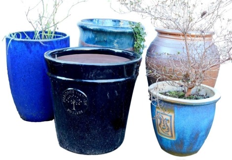 Five garden plant pots, of differing designs, colours and styles, to include a blue glazed example, 49cm high.