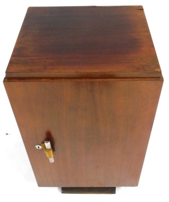 An Art Deco rosewood canteen cabinet, the hinged door enclosing five drawers, with compartments for cutlery, above a recess, raised on a shaped base, 90cm high, 50cm wide, 40cm deep. - 3