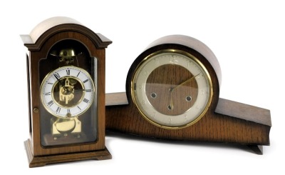 A 1950s/60s oak cased mantel clock with Westminster chime, and a Continental mantel clock in a mahogany case. (2)