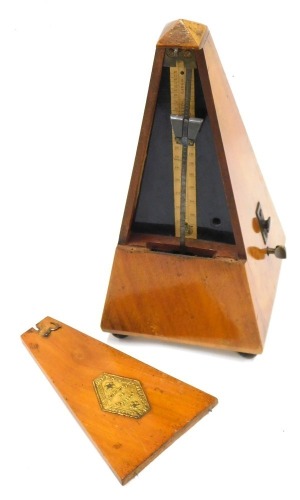 A late 19thC French Maelzel metronome, in mahogany case, with gilt metal lozenge plaque, numbered to underside 274074, 22cm high.