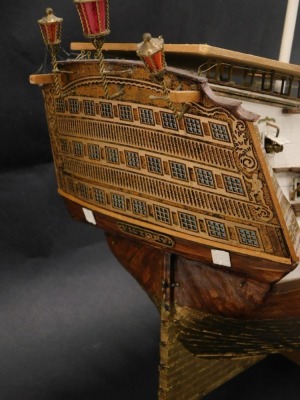 A scale model of HMS Victory, with three masts, various fitted cannon, part gilt metal hull, etc., 102cm long. - 2