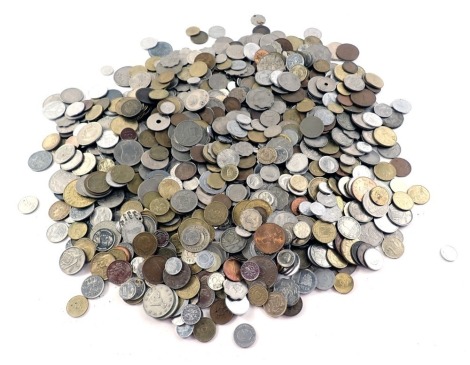 A quantity of foreign coinage, pesos and other. (1 tin)