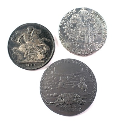 Three collectors coins, comprising a Salvador Mvndi collectors medallion, a silver 1780 five pound coin, and a Victorian 1890 coin. (3)