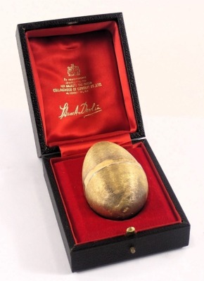 A Stuart Devlin silver parcel gilt frog and lily pad egg , London 1972, with unmarked silver gilt coloured stand, 3.83oz, 7cm high, boxed. - 4