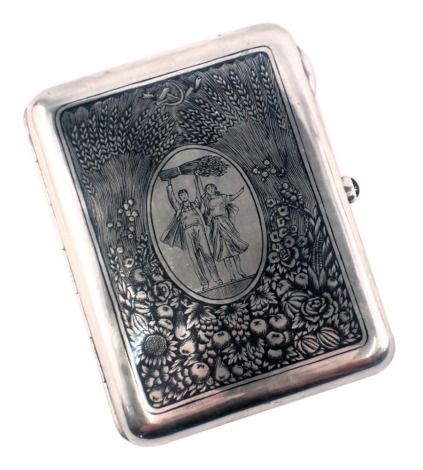 A Russian silver cigarette case, with niello decoration of rural workers or peasants carrying a wheat bundle, within oval vignette surrounded by flowers, wheat, etc., the opening button with blue cabochon, enclosing a vacant gilt interior, marks in Cyrill