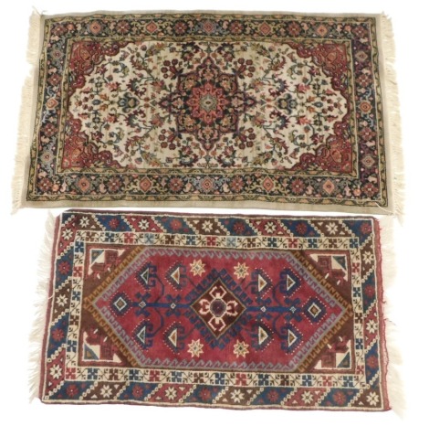 A Turkish pattern rug, with a pole medallion, 132cm x 75cm, and a Belgian Kadjar machine woven rug, 91cm x 158cm.