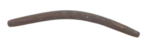 A carved hardwood aboriginal tribal boomerang, decorated with snakes, etc., 76cm wide.