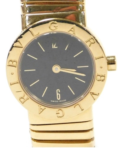 A Bulgari lady's 18ct gold cased wristwatch, with black dial bearing Arabic numerals at 6 & 12, quartz movement, on an expanding bracelet strap, reference BB232T, serial no. P80706, stamped to case back and strap, boxed and outer boxed, 78.4g all in.