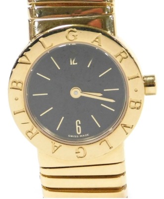 A Bulgari lady's 18ct gold cased wristwatch, with black dial bearing Arabic numerals at 6 & 12, quartz movement, on an expanding bracelet strap, reference BB232T, serial no. P80706, stamped to case back and strap, boxed and outer boxed, 78.4g all in.