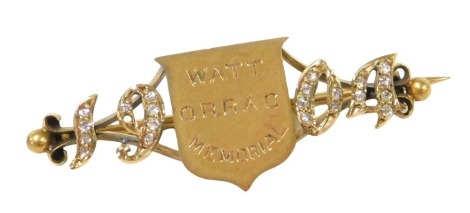 An Edwardian 18ct gold and diamond brooch, of equestrian interest, the central shield engraved Watt Orrag Memorial, flanked by the date 1904, inset with rose cut diamonds, boxed, 7.4g. The brooch is believed to have been given for the winner of the Watt 