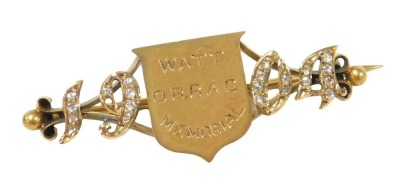 An Edwardian 18ct gold and diamond brooch, of equestrian interest, the central shield engraved Watt Orrag Memorial, flanked by the date 1904, inset with rose cut diamonds, boxed, 7.4g. The brooch is believed to have been given for the winner of the Watt