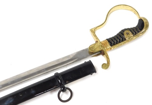 A Third Reich Wehrmacht officer's sword, with a gilt metal hilt, and languet with German eagle, celluloid grip with wire binding, and dove's head pommel, the curved fullered steal blade stamped Alcoso, Germany, in a black scabbard, with single suspension