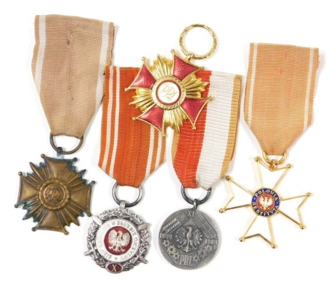 A group of Polish orders and medals, comprising Knight's Cross, Order of Polonia Restituta, Polish Cross of Merit in gold, lacking ribbon, and another in bronze, Medal of the Armed Forces in the Service of the Fatherland, in silver, and the Medal of the 4