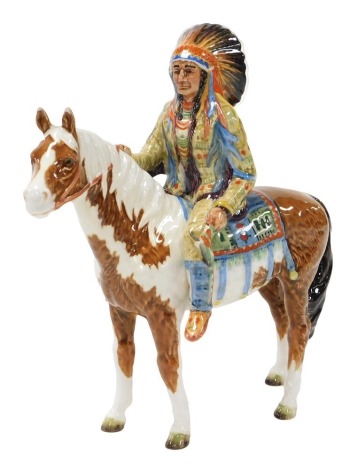 A Beswick pottery figure of a mounted native American Indian, on a skewbald horse, model 1391, printed marks. (AF)