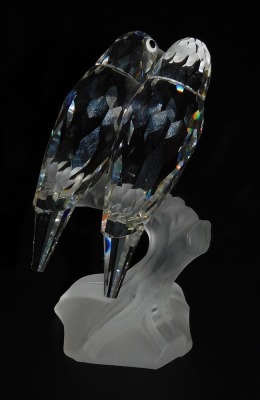 A pair of Swarovski crystal parakeets, modelled perched on the frosted glass branch of a tree stump, 10cm high. - 3