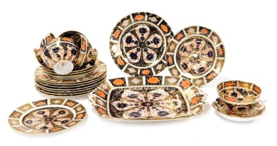 A Royal Crown Derby Imari porcelain part tea service, pattern no. 1128, comprising, bread plate, spoon dish, five tea cups, three saucers, two small and eight larger tea plates.